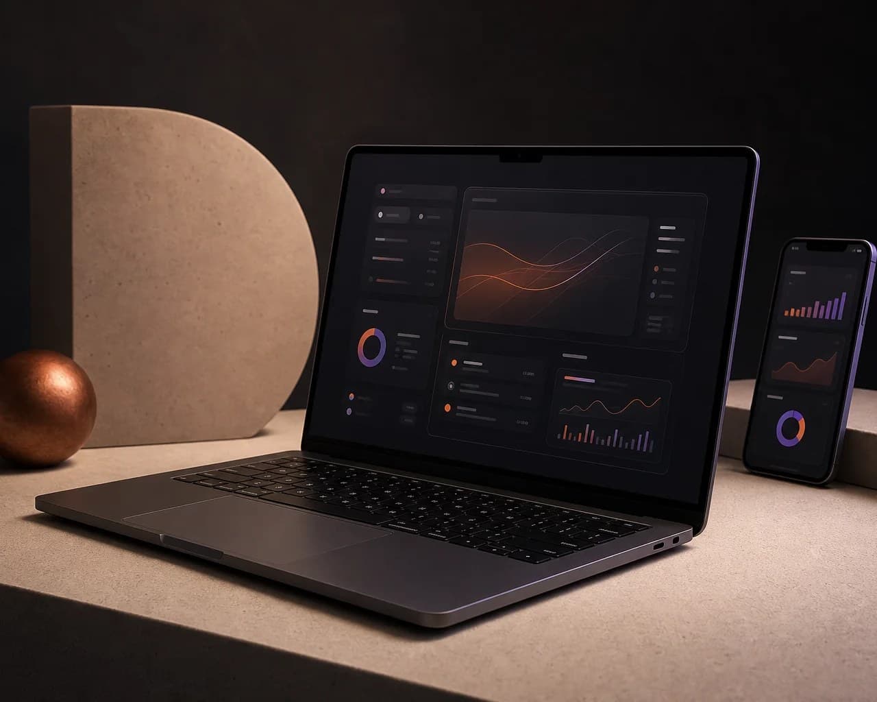 Premium laptop and mobile device displaying custom software dashboards